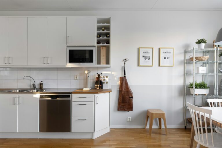 white kitchen open floor plan capsule kitchen on a budget